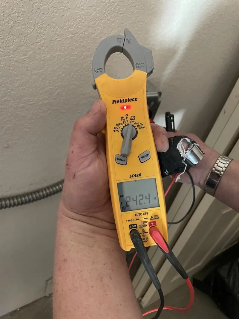 Voltage testing with clamp meter during Electrical Installation Services in San Marcos
